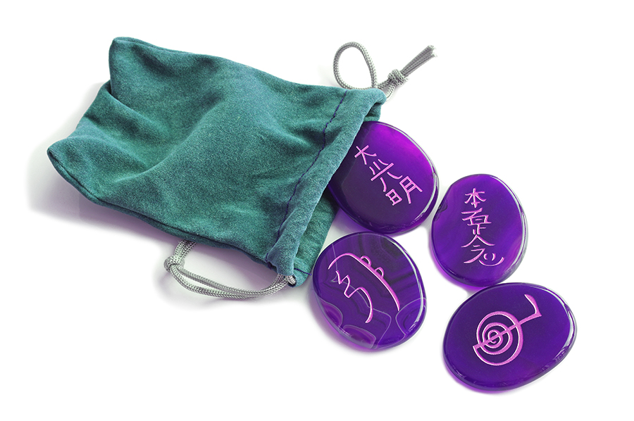 Gift bag containing four Reiki Symbol polished stones Reiki Stones